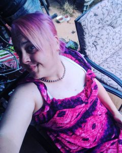 photo of Zoe Annelise in pink and purple hair and cute pink dress